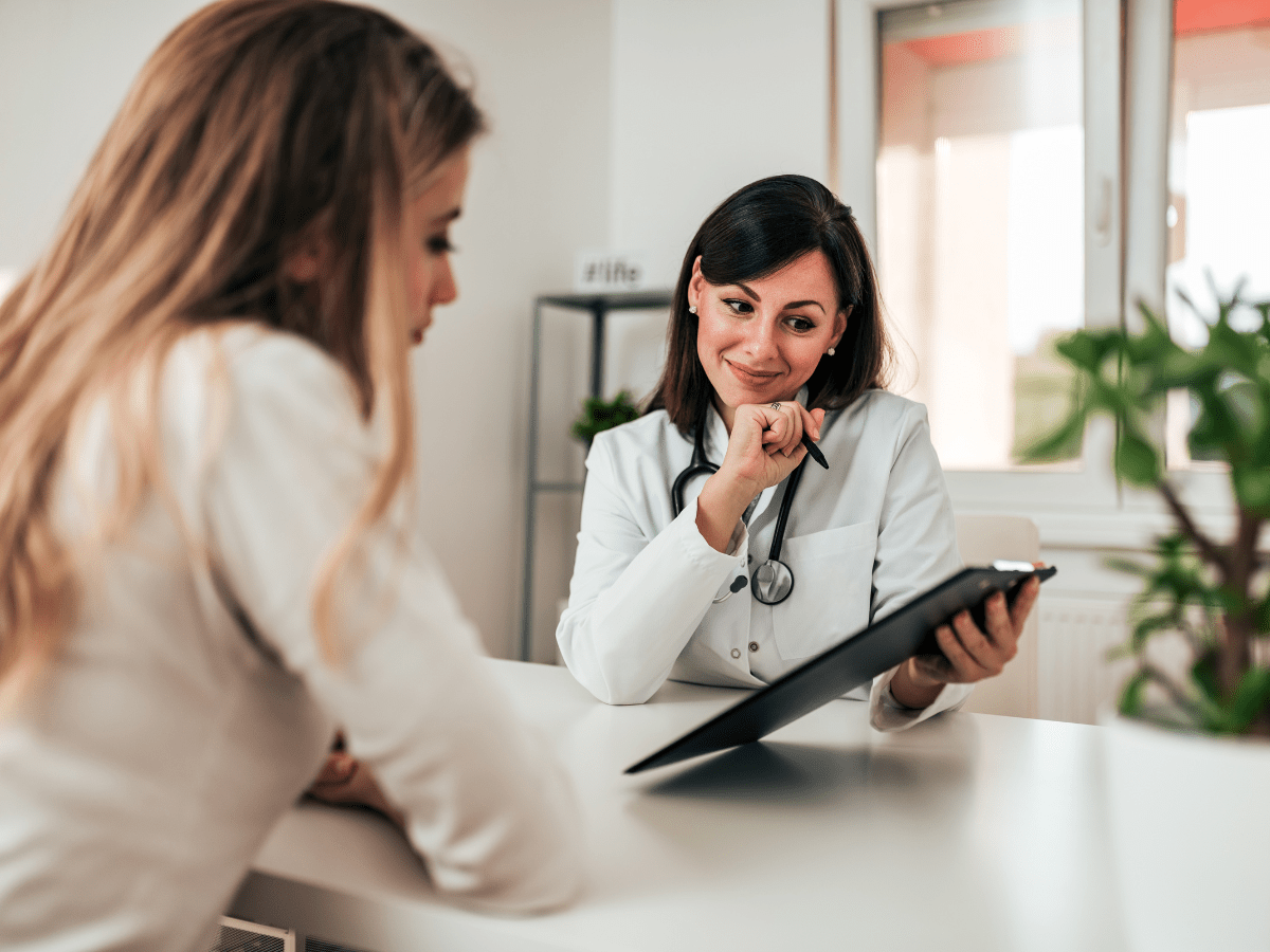 doctor showing patient forms